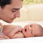 Father looking at newborn shutterstock_74803552